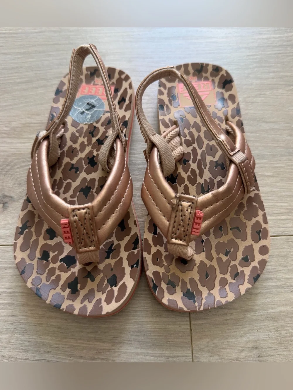 Reef Brown Leopard Print Flip Flops with Metallic Bronze Straps
